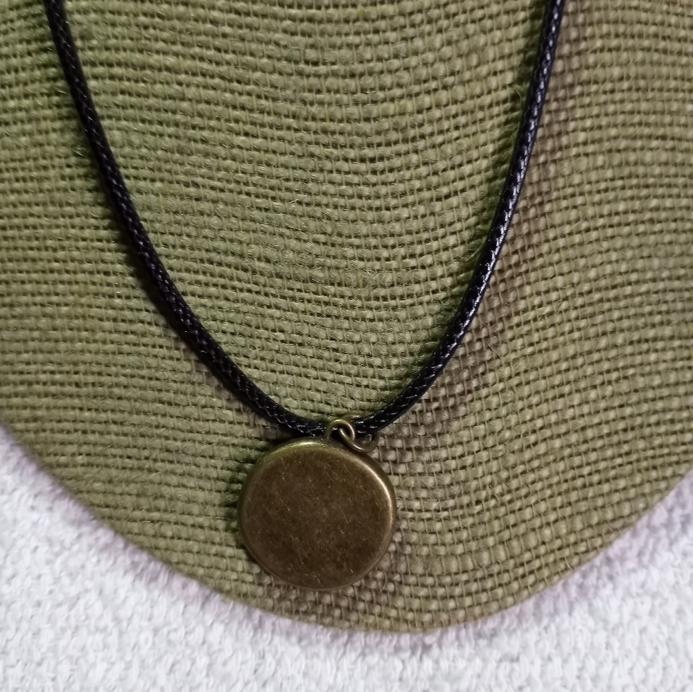 Goldtone be inspired round pendant on black cord necklace - Picture 2 of 4